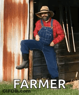 Farmer Sitting In Front Of Barn GIF