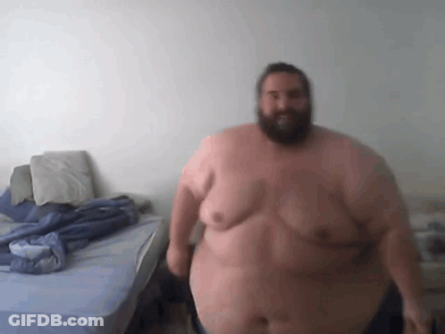 Fat Bearded Man Beside Bed GIF