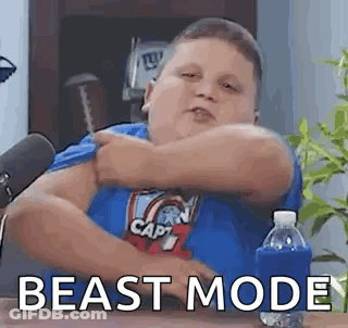 Fat Boy In Blue Shirt Sitting At Table With Water And Microphone GIF
