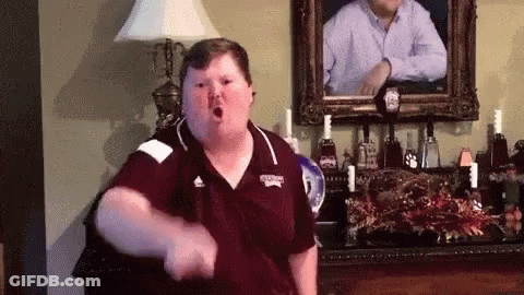 Fat Man Dancing In Living Room With Portrait GIF