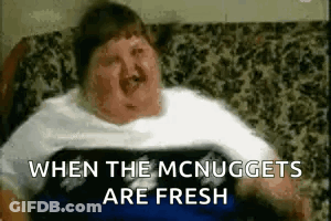 Fat Man Lying On Couch With When The McNuggets Are Fresh GIF