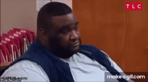 Fat Man Sitting In Front Of Red Envelopes GIF