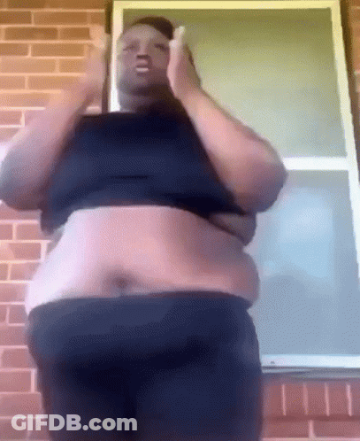 Fat Man Standing In Front Of Brick Wall GIF