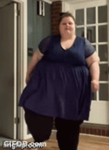 Fat Woman In Blue Dress Walking In Hallway GIF
