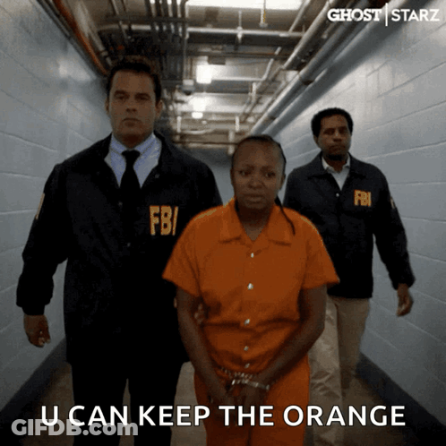 FBI Agent Leading Prisoner Down Hallway GIF