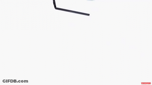 Feather Floating Next To Lenovo Laptop GIF