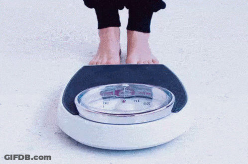Feet On Scale With Number 10 GIF