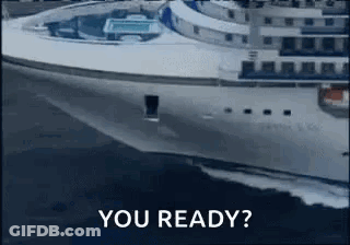 Feet Rest On Small Table Over Ocean GIF