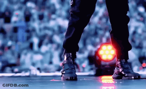 Feet Standing In Front Of Red Light GIF