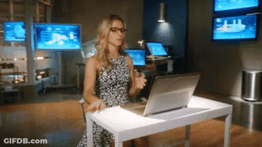 Felicity Arrow Cracking Knuckles Preparing For Research GIF