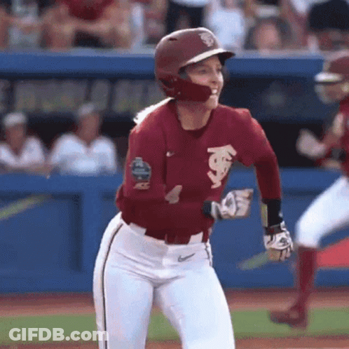 Female Baseball Player In Maroon Jersey And White Pants GIF