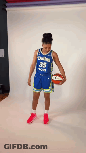 Female Basketball Player From Dallas Holding Ball GIF