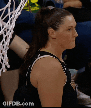 Female Basketball Player In Black Jersey With Ponytail GIF