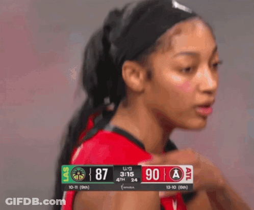 Female Basketball Player In Front Of Las Vegas Scoreboard GIF