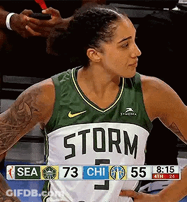 Female Basketball Player In Green And White Storm Jersey GIF