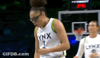Female Basketball Player In Lynx Jersey Beside Hoop GIF