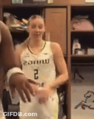 Female Basketball Player In Number 2 Jersey In Locker Room GIF