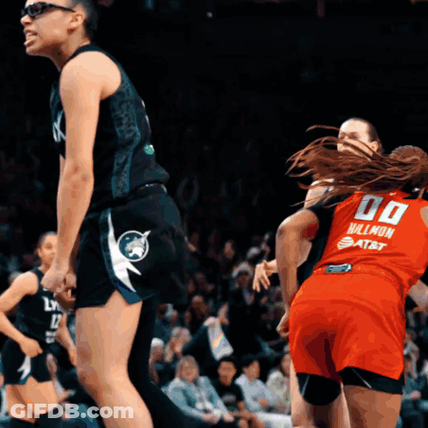 Female Basketball Player In Red Jersey Number 00 GIF