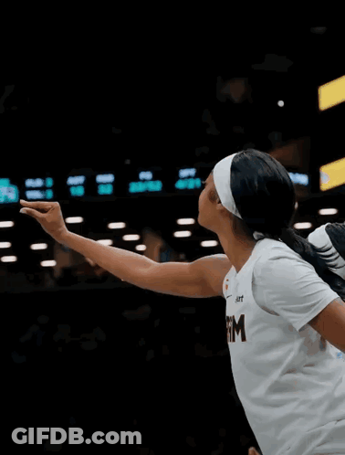 Female Basketball Player In White Shirt With Letter M GIF