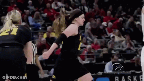 Female Basketball Player Jumping With Referee GIF