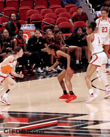 Female Basketball Player Number 23 Dribbling GIF