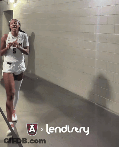 Female Basketball Player Number 5 In Locker Room GIF