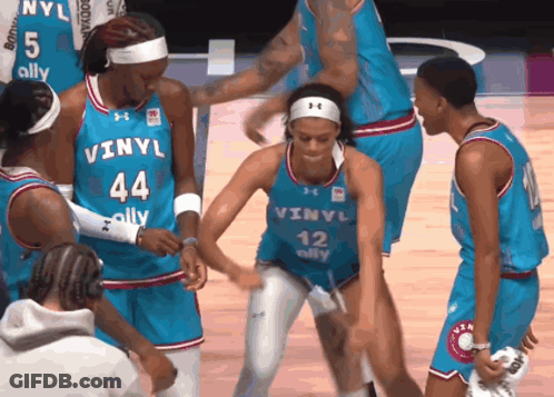 Female Basketball Players In Blue Vinyl Uniforms GIF