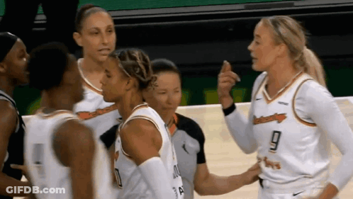 Female Basketball Players Talking On Court GIF