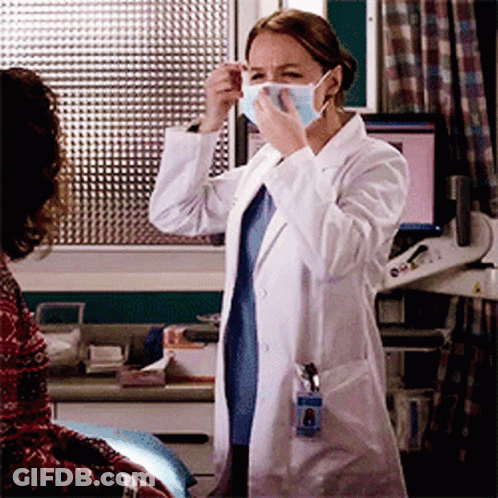 Female Doctor Wearing Mask And Name Tag GIF