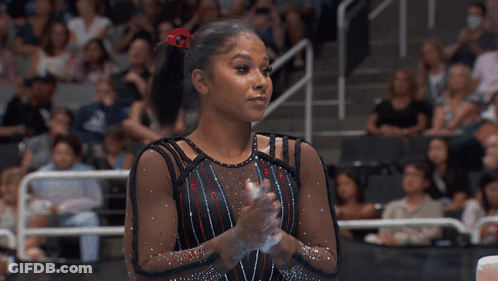 Female Gymnast Clapping Before Crowd GIF