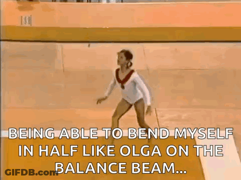 Female Gymnast Doing Balance Beam Trick GIF