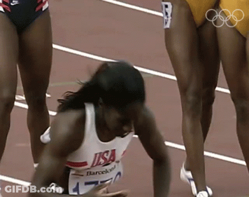 Female Runner In USA Shirt Lying On Ground GIF