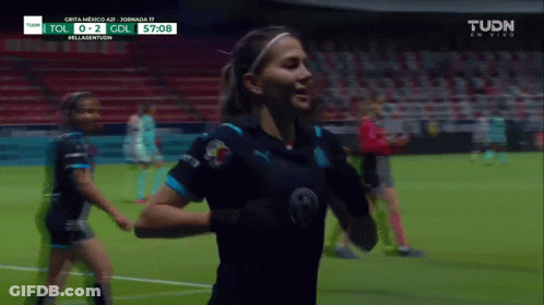Female Soccer Player Celebrates Goal GIF