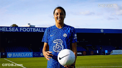 Female Soccer Player Holding Ball On Barclays Field GIF
