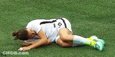 Female Soccer Player Lying With Head Down GIF