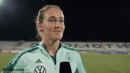 Female Soccer Player With Microphone On Field GIF