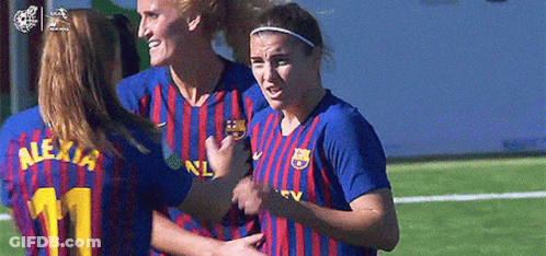Female Soccer Players Hugging On Field GIF