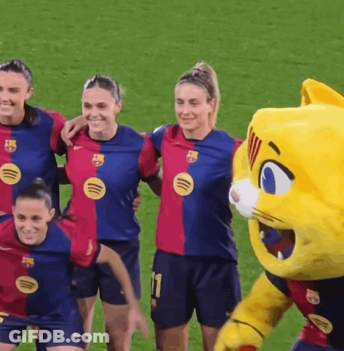 Female Soccer Players Posing With Mascot GIF