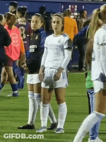 Female Soccer Players Standing On Field GIF