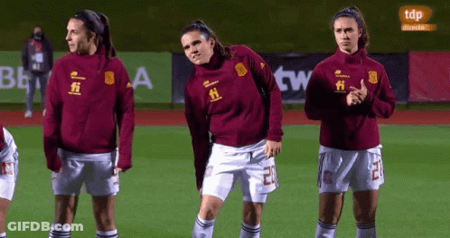 Female Soccer Players Standing With TDP In Background GIF