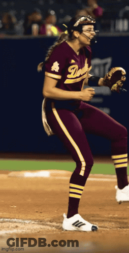 Female Softball Player In Maroon And Gold Duke Uniform GIF