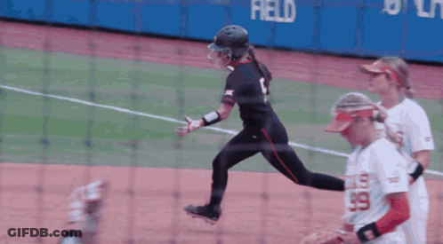 Female Softball Player Number 99 Runs To Base GIF