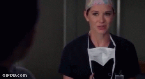 Female Surgeon Putting On Mask GIF