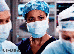 Female Surgeon Wearing Mask And Cap GIF
