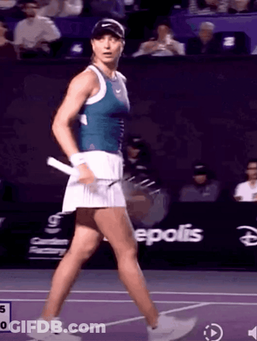 Female Tennis Player Walking On Court With Epolis GIF