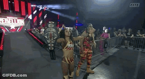 Female Wrestler Holding Championship Belt GIF