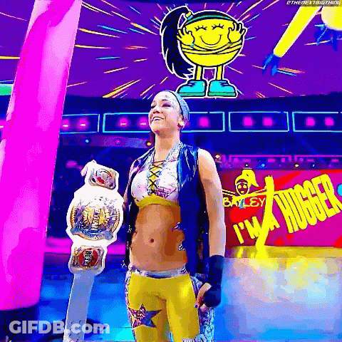 Female Wrestler Holding Championship Belt In Front Of I'm A Hugger Sign GIF