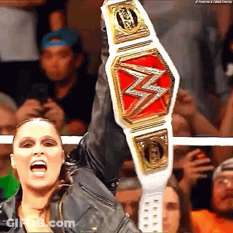 Female Wrestler Holding Championship Belt GIF