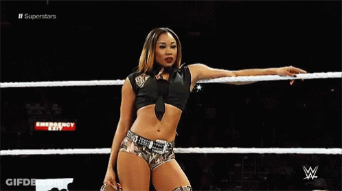 Female Wrestler Holding Rope In Wrestling Ring GIF