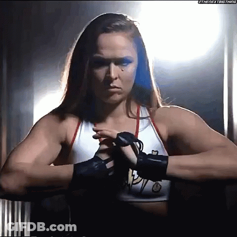 Female Wrestler In Dark Room With Boxing Gloves GIF